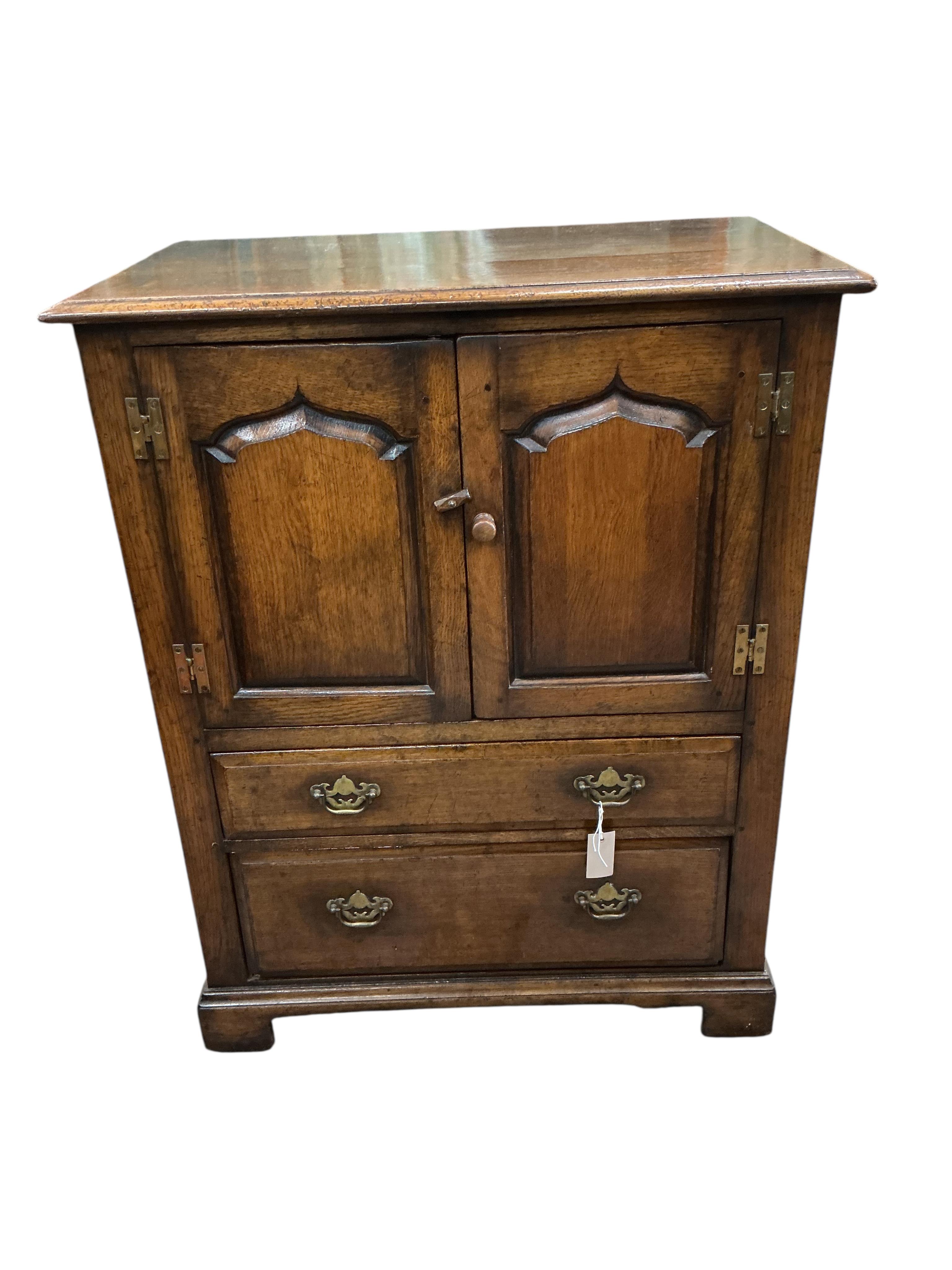 A reproduction 18th century style oak two drawer side cabinet, width 81cm, depth 48cm, height 103cm